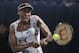 FILE - In this Feb. 22, 2014, file photo, Venus Williams, of the United States, returns the ball to Alize Cornet, of France, during the Dubai Duty Free Tennis Championships in Dubai, United Arab Emirates. Swimmer Michael Phelps and Williams highlight the 22 athletes who will be featured in the ESPN The Magazine Body Issue, which will hit newsstands on July 11, 2014. (AP Photo/Kamran Jebreili, File)