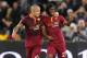 ROME, ITALY - APRIL 25: Gervinho (R) with his teammate Radja Nainggolan celebrates after scoring the second team's goal during the Serie A match between AS Roma and AC Milan at Stadio Olimpico on April 25, 2014 in Rome, Italy. (Photo by Paolo Bruno/Getty Images)