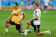 BELO HORIZONTE, BRAZIL - JULY 07: Toni Kroos (R) of Germany stretches during the German national team training at Estadio Mineirao on July 7, 2014 in Belo Horizonte, Brazil. (Photo by Martin Rose/Getty Images)