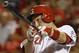 Cincinnati Reds' Todd Frazier gets a hit off Chicago Cubs starting pitcher Edwin Jackson to drive in a run in the fifth inning of a baseball game, Monday, July 7, 2014, in Cincinnati. (AP Photo/Al Behrman)