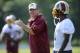 Washington Redskins head coach Jay Gruden, left, talks with wide receiver DeSean Jackson, right, during NFL football minicamp, Wednesday, June 18, 2014, in Ashburn, Va. (AP Photo/Nick Wass)