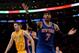 LOS ANGELES, CA - MARCH 25: Carmelo Anthony #7 of the New York Knicks reacts for a foul in front of Ryan Kelly #4 of the Los Angeles Lakers during the game at Staples Center on March 25, 2014 in Los Angeles, California. NOTE TO USER: User expressly acknowledges and agrees that, by downloading and or using this Photograph, user is consenting to the terms and condition of the Getty Images License Agreement. (Photo by Harry How/Getty Images)