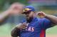 Texas Rangers first baseman Prince Fielder warms up before facing the Colorado Rockies in the first inning of an interleague baseball game in Denver on Tuesday, May 6, 2014. (AP Photo/David Zalubowski)