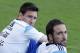 Argentina's Lionel Messi, left, sits next to teammate Gonzalo Higuain during a training session in Vespesiano, near Belo Horizonte, Brazil, Sunday, July 6, 2014. Argentina will face Netherlands on their semifinal match of the 2014 World Cup soccer tournament on July 9 in Sao Paulo.(AP Photo/Victor R. Caivano)