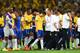 BELO HORIZONTE, BRAZIL - JULY 08: Oscar of Brazil (center) reacts with teammates after being defeated 7-1 by Germany during the 2014 FIFA World Cup Brazil Semi Final match between Brazil and Germany at Estadio Mineirao on July 8, 2014 in Belo Horizonte, Brazil. (Photo by Buda Mendes/Getty Images)