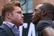 LOS ANGELES, CA - MAY 06: Boxers Canelo Alvarez (L) and Erislandy Lara face off onstage prior to the press conference for Canelo Alvarez v Erislandy Lara on May 6, 2014 in Los Angeles, California. (Photo by Victor Decolongon/Getty Images)