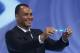 Former soccer great and World Cup winner Cafu from Brazil holds the ticket of Brazil during the draw ceremony for the 2014 soccer World Cup in Costa do Sauipe near Salvador, Brazil, Friday, Dec. 6, 2013. (AP Photo/Victor R. Caivano)