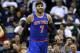 New York Knicks small forward Carmelo Anthony (7) smiles after scoring during the second half of an NBA basketball game against the New Orleans Pelicans in New Orleans, Wednesday, Feb. 19, 2014. The Knicks won 98-91. (AP Photo/Jonathan Bachman)