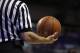 A referee holds a ball during the first half of an NCAA college basketball game between Saint Louis and Fordham Saturday, Jan. 18, 2014, in St. Louis. (AP Photo/Jeff Roberson)