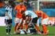 SAO PAULO, BRAZIL - JULY 09: Javier Mascherano of Argentina lies on the pitch after a collision as teammates Lionel Messi and Lucas Biglia stand over during the 2014 FIFA World Cup Brazil Semi Final match between the Netherlands and Argentina at Arena de Sao Paulo on July 9, 2014 in Sao Paulo, Brazil. (Photo by Ronald Martinez/Getty Images)