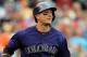 Colorado Rockies' Troy Tulowitzki watches a pop fly against the Arizona Diamondbacks during the third inning of a baseball game Wednesday, June 4, 2014, in Denver. (AP Photo/Jack Dempsey)