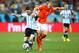 SAO PAULO, BRAZIL - JULY 09: Lionel Messi of Argentina is challenged by Ron Vlaar of the Netherlands during the 2014 FIFA World Cup Brazil Semi Final match between the Netherlands and Argentina at Arena de Sao Paulo on July 9, 2014 in Sao Paulo, Brazil. (Photo by Jamie Squire/Getty Images)