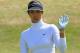 SOUTHPORT, ENGLAND - JULY 10: Michelle Wie of the United States acknowledges the crowd during the first round of the Ricoh Women's British Open at Royal Birkdale on July 10, 2014 in Southport, England. (Photo by David Cannon/Getty Images)
