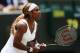 Serena Williams prepares to receive serve during a Wimbledon match.