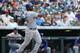 Los Angeles Dodgers' Yasiel Puig follows the flight of his RBI-double against the Colorado Rockies in the eighth inning of a Dodgers' 8-2 victory in a baseball game in Denver, Sunday, July 6, 2014. (AP Photo/David Zalubowski)