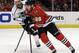Chicago Blackhawks' Patrick Kane (88), right, controls the puck against Los Angeles Kings' Jeff Carter (77) during the first period in Game 1 of the Western Conference finals in the NHL hockey Stanley Cup playoffs in Chicago on Sunday, May 18, 2014. (AP Photo/Nam Y. Huh)