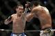 Chris Weidman, left, hits Lyoto Machida during their mixed martial arts middleweight title bout at UFC 175 Saturday, July 5, 2014, in Las Vegas. (AP Photo/John Locher)