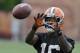 Cleveland Browns wide receiver Andrew Hawkins catches balls after organized team activities at the NFL football team's facility in Berea, Ohio Tuesday, June 3, 2014. (AP Photo/Mark Duncan)
