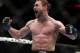 Ali Bagautinov, of Russia, reacts after defeating John Lineker, of Brazil, during the third round of a UFC 169 flyweight mixed martial arts bout in Newark, N.J., Saturday, Feb. 1, 2014. Bagautinov won by unanimous decision. (AP Photo/Tim Larsen)
