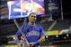 American League's Yoenis Cespedes, of the Oakland Athletics, poses with the trophy after winning the MLB All-Star baseball Home Run Derby, on Monday, July 15, 2013 in New York. (AP Photo/Kathy Willens)
