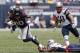 Houston Texans wide receiver DeAndre Hopkins (10) is tripped up by a New England Patriots defender during the second quarter of an NFL football game Sunday, Dec. 1, 2013, in Houston. (AP Photo/Patric Schneider)