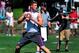 Jul 10, 2014; Beaverton, OR, USA; Apocalypse quarterback Blake Barnett (12) passes the ball during Nike Football ' The Opening' at Nike World Headquarters. Mandatory Credit: Steve Dykes-USA TODAY Sports