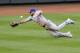 A ball hit by Baltimore Orioles' Manny Machado for a double gets by Toronto Blue Jays left fielder Melky Cabrera during the second inning of a baseball game on Friday, June 13, 2014, in Baltimore. (AP Photo/Nick Wass)