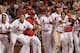 The St. Louis Cardinals celebrate after Matt Adams' walk-off home run against the Pirates on July 8.