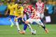 SAO PAULO, BRAZIL - JUNE 12: Luka Modric of Croatia controls the ball against Oscar of Brazil during the 2014 FIFA World Cup Brazil Group A match between Brazil and Croatia at Arena de Sao Paulo on June 12, 2014 in Sao Paulo, Brazil. (Photo by Buda Mendes/Getty Images)