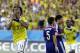 Colombia's Juan Cuadrado celebrates after scoring the opening goal from the penalty spot during the group C World Cup soccer match between Japan and Colombia at the Arena Pantanal in Cuiaba, Brazil, Tuesday, June 24, 2014. (AP Photo/Kirsty Wigglesworth)