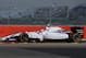 Williams test driver Susie Wolff rounds the track during a practice session before the British Formula One Grand Prix at Silverstone, England, Friday, July 4, 2014. Wolff's bid to make an impact as the first woman to take part in a Formula One grand prix weekend for 22 years ended prematurely on Friday, when her Williams car, idled to a halt after only three timed laps in the opening practice. The British Formula 1 Grand Prix will be held on Sunday July 6, 2014. (AP Photo/Jon Super)