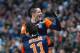 Montpellier's Argentinian forward Emanuel Herrera, back, reacts with Montpellier's French midfielder Remy Cabella, after scoring, during their League One soccer match against Marseille, in Marseille, southern France, Saturday, Jan. 19, 2013. (AP Photo/Claude Paris)