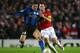 MANCHESTER, UNITED KINGDOM - MARCH 11: Javier Zanetti of Inter Milan tussles for posession with Ryan Giggs of Manchester United during the UEFA Champions League Round of Sixteen, Second Leg match between Manchester United and Inter Milan at Old Trafford on March 11, 2009 in Manchester, England. (Photo by Alex Livesey/Getty Images)
