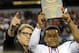 Texas Gov. Rick Perry, left, poses for photos with the most valuable player, offensive, Allen quarterback Kyler Murray, following a 63-28 win over Pearland during a UIL Class 5A Division I high school football championship game on Saturday, Dec. 21, 2013, in Arlington, Texas. (AP Photo/Matt Strasen)