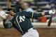 Oakland Athletics Yoenis Cespedes reacts during an at-bat in an inter-league baseball game against the New York Mets in New York, Tuesday, June 24, 2014. The Mets defeated the Athletics 10-1. (AP Photo/Kathy Willens)