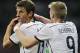 Germany's Andre Schuerrle celebrates with Thomas Mueller after Mesut Ozil scored his side's second goal in extra time during the World Cup round of 16 soccer match between Germany and Algeria at the Estadio Beira-Rio in Porto Alegre, Brazil, Monday, June 30, 2014. Germany defeated Algeria 2-1 to advance to the quarterfinals. (AP Photo/Matthias Schrader)