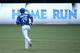 TORONTO, CANADA - JULY 2: Jose Bautista #19 of the Toronto Blue Jays circles the bases after hitting a solo home run in the first inning during MLB game action against the Milwaukee Brewers on July 2, 2014 at Rogers Centre in Toronto, Ontario, Canada. (Photo by Tom Szczerbowski/Getty Images)