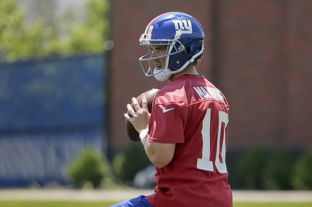 Manning Works with Odell Beckham at Manning Passing Academy