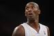 In this Dec. 8, 2013, photo, Los Angeles Lakers' Kobe Bryant looks back during his team's loss to the Toronto Raptors during an NBA basketball game in Los Angeles. Bryant is expected to miss about six weeks with an injured left knee. The Lakers said Thursday, Dec. 19, 2013, that an MRI scan showed that Bryant has a fracture of the lateral tibial plateau of his knee. (AP Photo/Danny Moloshok)