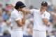 NOTTINGHAM, ENGLAND - JULY 12: England captain Alastair Cook speaks with James Anderson during day four of 1st Investec Test match between England and India at Trent Bridge on July 12, 2014 in Nottingham, England. (Photo by Gareth Copley/Getty Images)