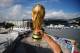 RIO DE JANEIRO, BRAZIL - JUNE 11: A fan holds a replica of the World Cup Trophy near the Maracana Stadium on June 11, 2014 in Rio de Janeiro, Brazil. (Photo by Matthias Hangst/Getty Images)