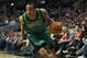 Boston Celtics guard Avery Bradley drives to the basket against the Chicago Bulls during an NBA basketball game in Chicago, Monday, March 31, 2014. The Bulls won 94-80. (AP Photo/Kamil Krzaczynski)