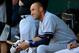 BALTIMORE, MD - JULY 11: Derek Jeter #2 of the New York Yankees looks on from the dugout against the Baltimore Orioles at Oriole Park at Camden Yards on July 11, 2014 in Baltimore, Maryland. (Photo by Rob Carr/Getty Images)