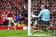 LONDON, ENGLAND - OCTOBER 19: Aaron Ramsey of Arsenal (C) shoots past goalkeeper John Ruddy of Norwich City to score their third goal during the Barclays Premier League match between Arsenal and Norwich City at Emirates Stadium on October 19, 2013 in London, England. (Photo by Paul Gilham/Getty Images)