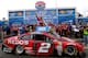 LOUDON, NH - JULY 13: Brad Keselowski, driver of the #2 Redds Ford, celebrates in victory lane after winning the NASCAR Sprint Cup Series Camping World RV Sales 301 at New Hampshire Motor Speedway on July 13, 2014 in Loudon, New Hampshire. (Photo by Jonathan Ferrey/Getty Images)
