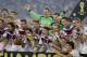 German players celebrate with the World Cup trophy following their 1-0 victory over Argentina after the World Cup final soccer match between Germany and Argentina at the Maracana Stadium in Rio de Janeiro, Brazil, Sunday, July 13, 2014. (AP Photo/Natacha Pisarenko)
