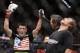 Dominick Cruz, left, celebrates his victory over Urijah Faber shortly after their UFC bantamweight mixed martial arts title match, Saturday, July 2, 2011 at The MGM Grand Garden Arena in Las Vegas. Cruz won by unanimous decision. (AP Photo/Eric Jamison)