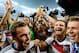 RIO DE JANEIRO, BRAZIL - JULY 13: Mesut Oezil of Germany raises the World Cup trophy with teammates Kevin Grosskreutz, Roman Weidenfeller, Shkodran Mustafi and Erik Durm after defeating Argentina 1-0 in extra time during the 2014 FIFA World Cup Brazil Final match between Germany and Argentina at Maracana on July 13, 2014 in Rio de Janeiro, Brazil. (Photo by Matthias Hangst/Getty Images)