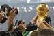 German players are surrounded by photographers during a victory lap after the World Cup final soccer match between Germany and Argentina at the Maracana Stadium in Rio de Janeiro, Brazil, Sunday, July 13, 2014. Germany won the match 1-0. (AP Photo/Matthias Schrader)