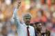 FILE - In this Saturday, May 17, 2014 file photo, Arsenal's manager Arsene Wenger punches the air in celebration of their win against Hull City at the end of their English FA Cup final soccer match at Wembley Stadium in London. Arsenal manager Arsene Wenger has signed a three-year deal with the Premier League club, keeping him at the Emirates Stadium until 2017. The new deal was announced by Arsenal on Friday and will take Wenger into his 21st year at the club, where he has been in charge since 1996. The 64-year-old Frenchman won three Premier League titles and four FA Cups in the first half of his Arsenal tenure, but failed to capture a trophy in nine years until winning this season's FA Cup. Wenger has guided the London side into the Champions League for 17 consecutive seasons and is the longest-serving manager in the Premier League. (AP Photo/Sang Tan, file)